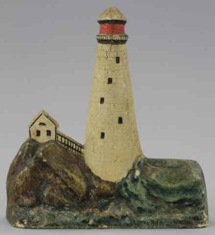 Appraisal: RUBBER LIGHTHOUSE DOORSTOP Well molded depicts lighthouse with red tower