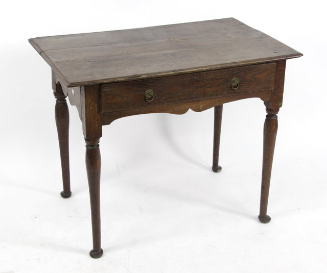 Appraisal: An th Century oak one-drawer side table on turned legs