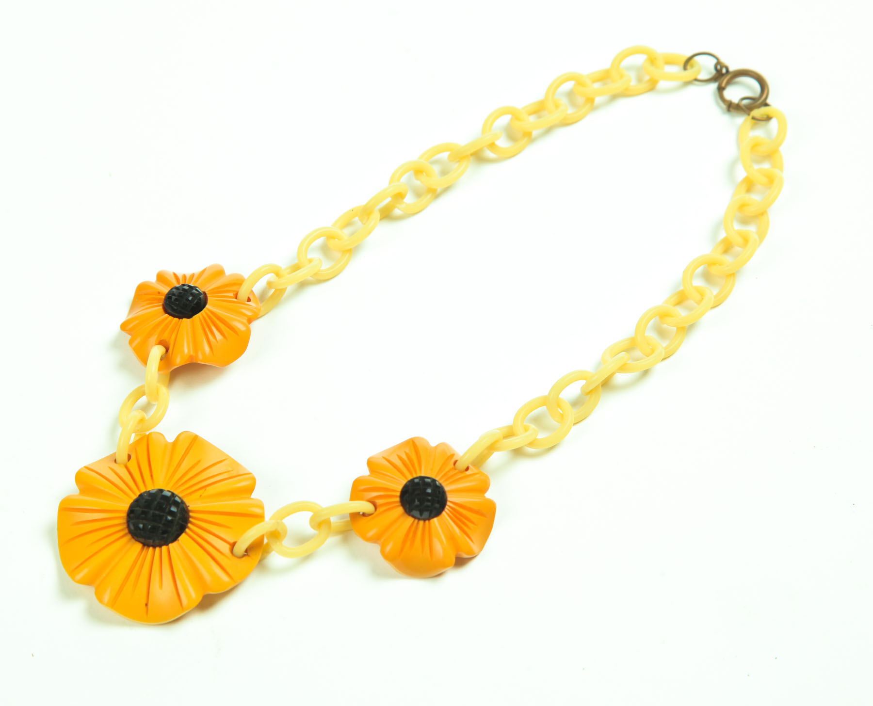 Appraisal: CARVED BAKELITE BLACK-EYED SUSAN NECKLACE American st half- th century