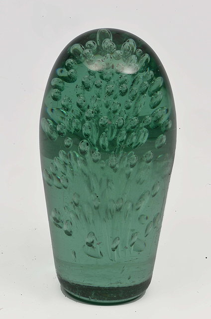 Appraisal: A GREEN GLASS DUMP PAPERWEIGHT together with two Troika style