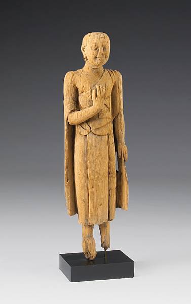 Appraisal: A Burmese carved figure of a standing Buddhist figure th