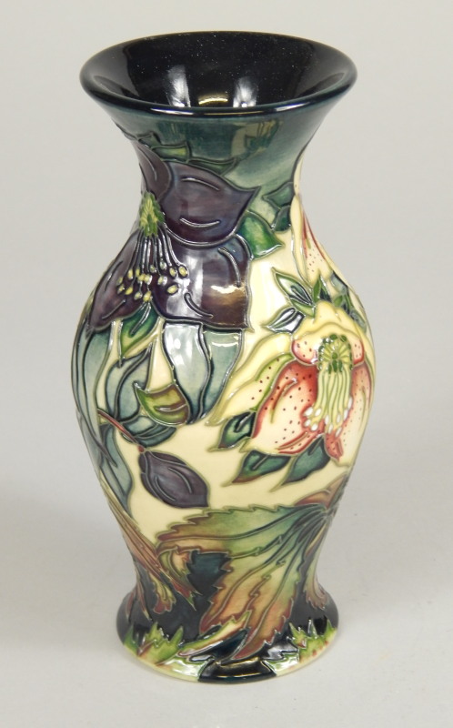 Appraisal: A Moorcroft vase with tube lined decoration of flowers impressed