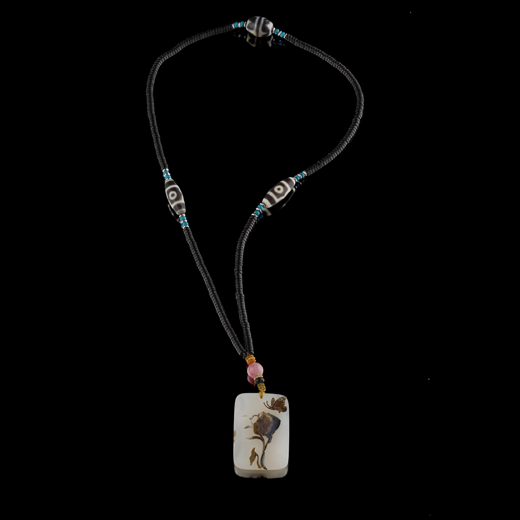 Appraisal: SUZHOU-STYLE AGATE PENDANT of rectangular form the translucent stone with