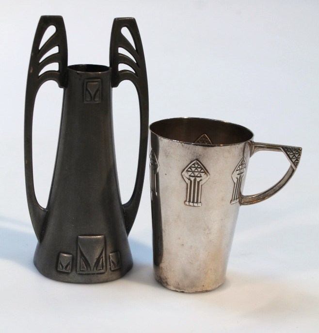 Appraisal: An early thC WMF Art Nouveau design silver plated tankard