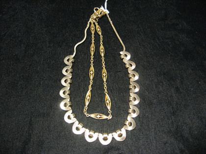 Appraisal: Two gold necklaces One heavy and with D-shaped parts the