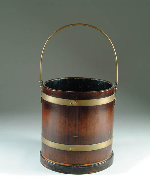 Appraisal: BRASS BOUND MAHOGANY BUCKET Large brass bale handle two brass