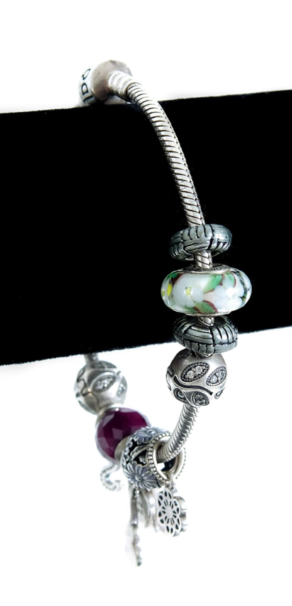 Appraisal: STERLING SILVER PANDORA CHARM BRACELETSterling silver Pandora charm bracelet with