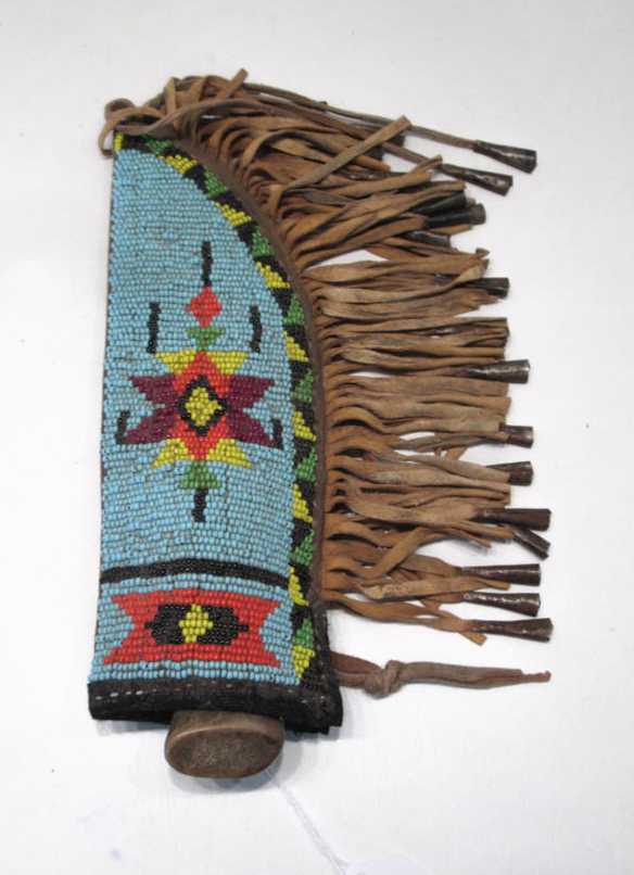 Appraisal: SOUTHWEST NATIVE AMERICAN KNIFE AND BEADED SHEATH the knife with