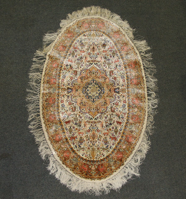 Appraisal: Hand woven silk oriental rug oval shape with vibrant center