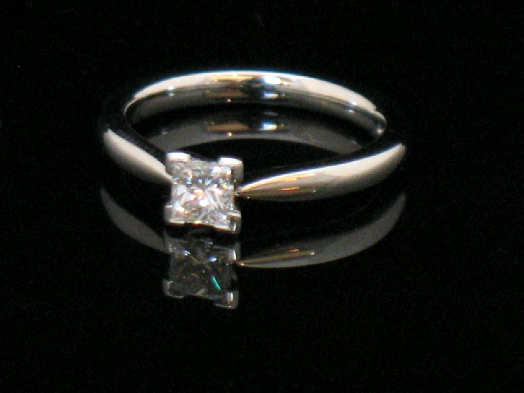 Appraisal: A DIAMOND SOLITAIRE RING the central princess-cut diamond c cts