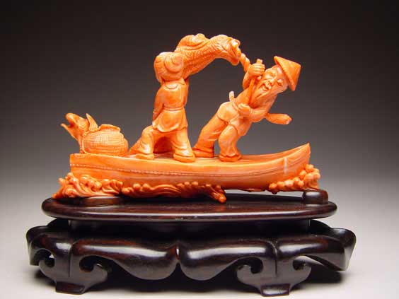 Appraisal: CARVED CORAL GROUP Well carved coral group of a woman