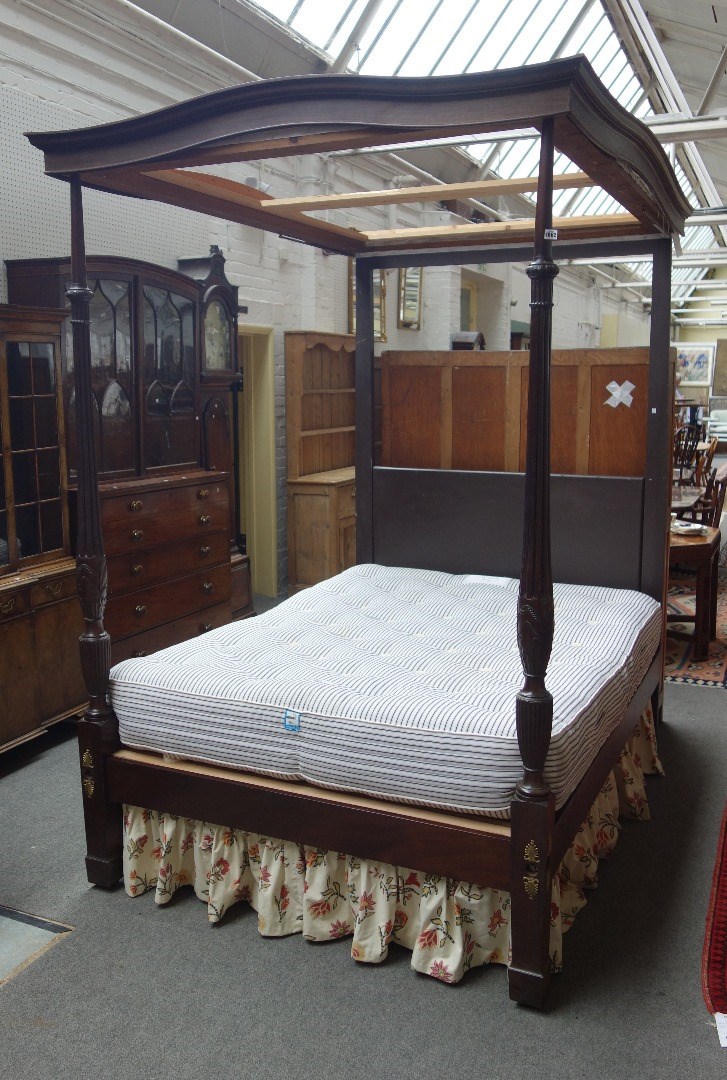 Appraisal: A mahogany four poster bed the moulded rectangular canopy over