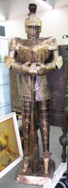 Appraisal: A copper-finished tin figure of knight in full armor with