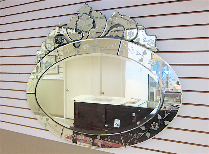 Appraisal: OVAL VENETIAN STYLE WALL MIRROR featuring an oval beveled glass