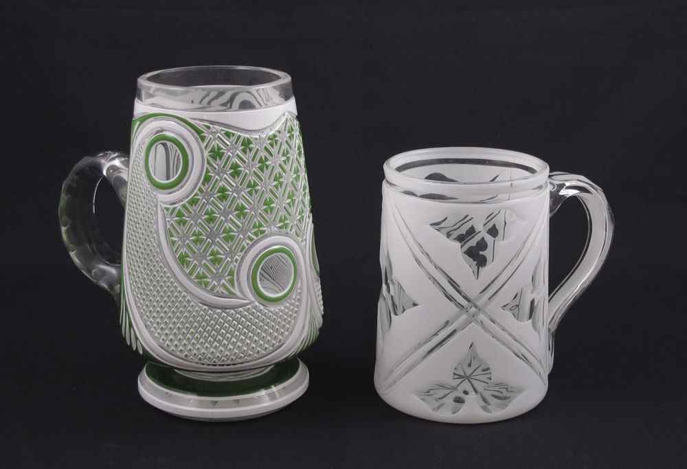 Appraisal: EARLY BOHEMIAN GLASS OVERLAY MUGS To include Green and white