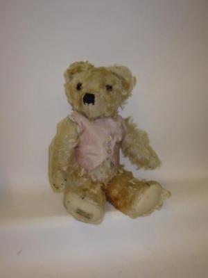 Appraisal: A pre-war Merrythought teddy bear covered in long faded apricot