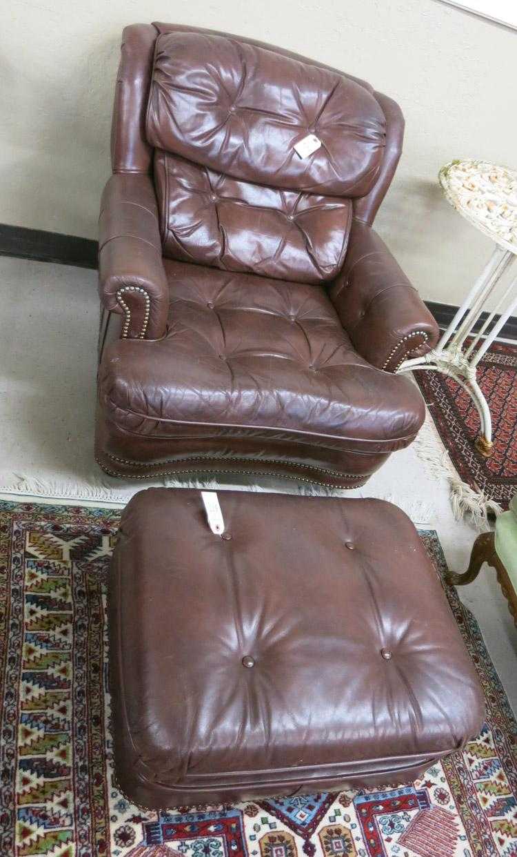 Appraisal: BROWN LEATHER EASY CHAIR AND MATCHING OTTOMAN Classic Leather Inc