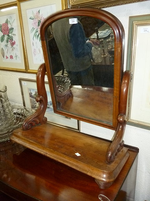 Appraisal: A VICTORIAN MAHOGANY SWING DRESSING TABLE MIRROR with arching mirror