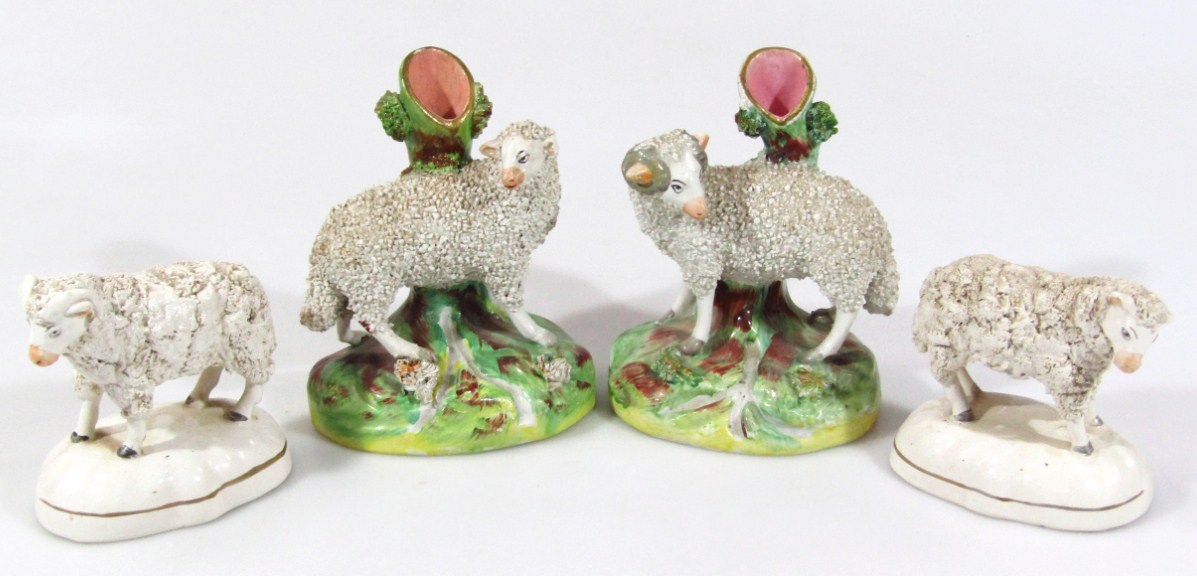 Appraisal: A pair of thC English semi-porcelain sheep spill vase groups