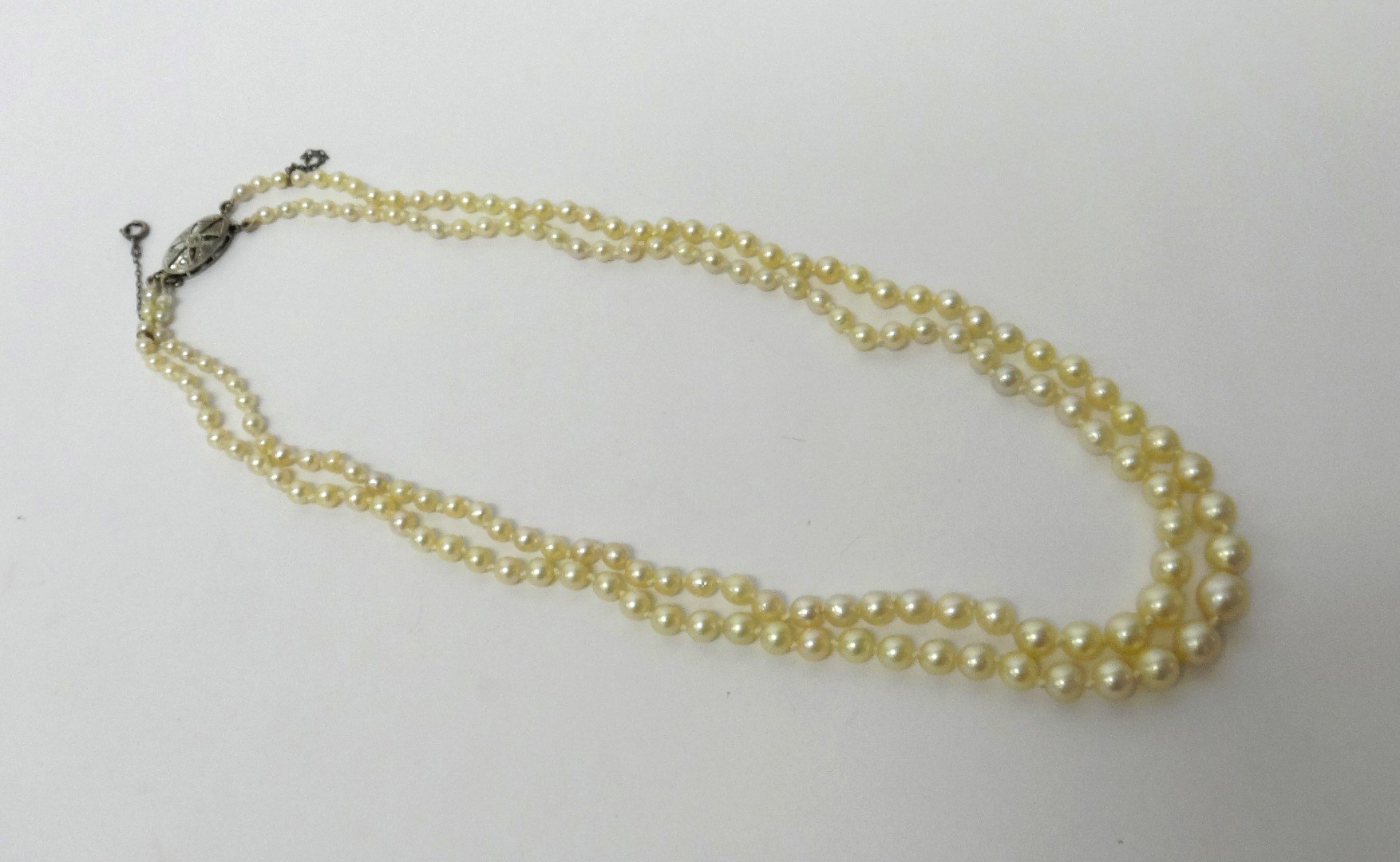 Appraisal: A two row necklace of cultured pearls graduating in size