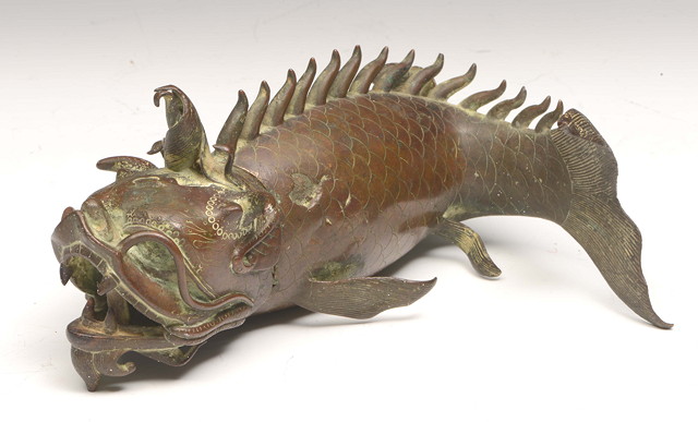 Appraisal: A CHINESE BRONZE INCENSE BURNER in the form of a