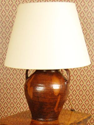 Appraisal: Two glazed earthenware lamps with lug handles inches cm high