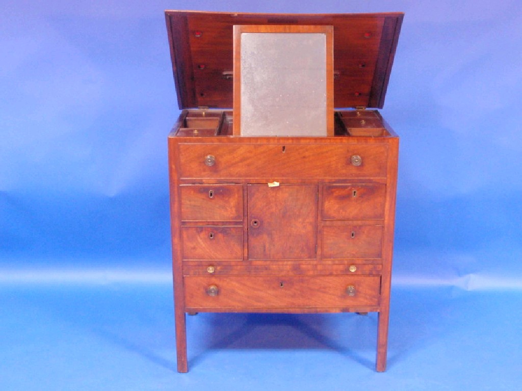 Appraisal: A George III figured mahogany gentleman's dressing chest with a