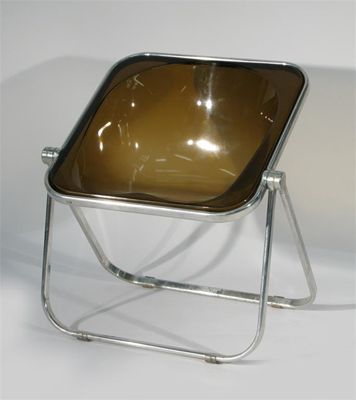 Appraisal: A Castelli chrome frame chair moulded plastic seat retail label