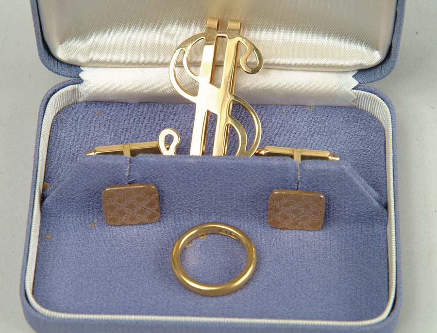 Appraisal: FOUR GOLD PIECES k dollar sign money clip Small k