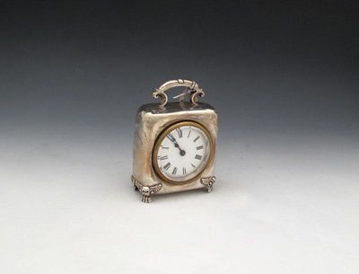 Appraisal: An Edwardian silver mantle clock by The Douglas Clock Company