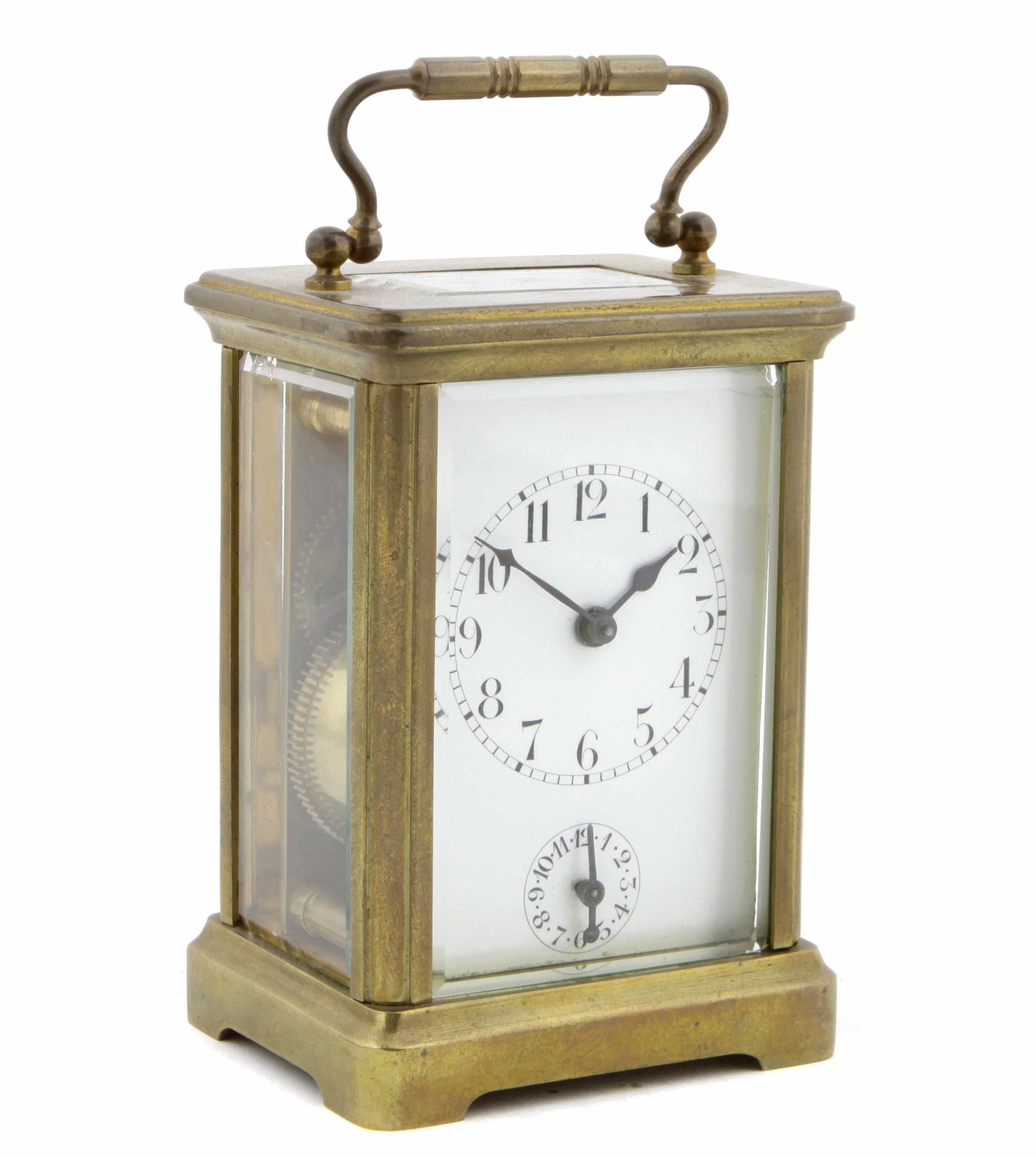 Appraisal: A French brass carriage time piece with subsidiary alarm dial