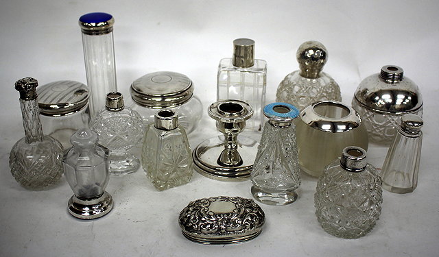 Appraisal: AN ASSORTMENT OF SILVER TOPPED BOTTLES perfume bottles and jars