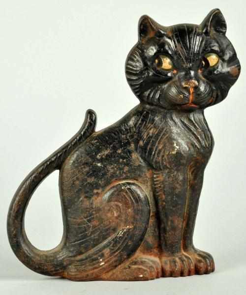 Appraisal: Cast Iron Sitting Cat Doorstop Description Marked Copyright A M