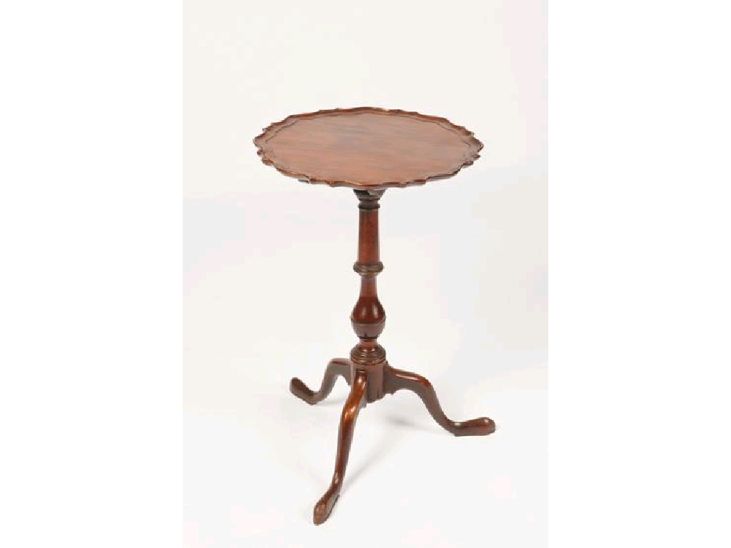 Appraisal: A GEORGE III MAHOGANY TRIPOD TABLE the tip-up circular top