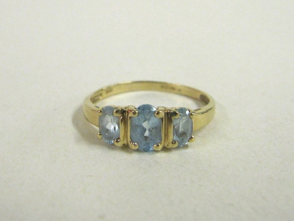 Appraisal: Nine carat gold blue topaz three stone ring