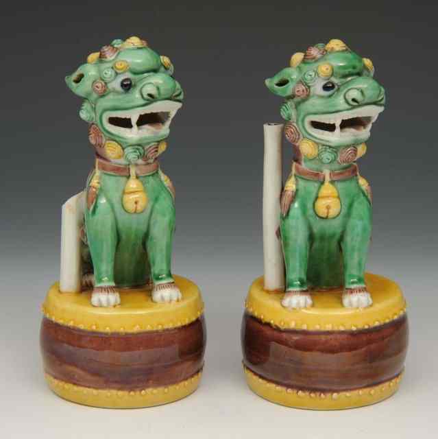 Appraisal: A PAIR OF CHINESE POLYCHROME JOSS STICK HOLDERS each in