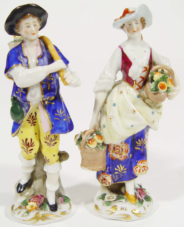 Appraisal: Pair of Italian porcelain figures with hand painted and gilded