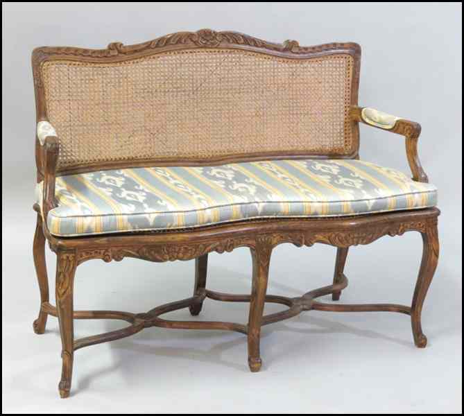 Appraisal: FRENCH PROVINCIAL STYLE CARVED WALNUT SETTEE H '' W ''