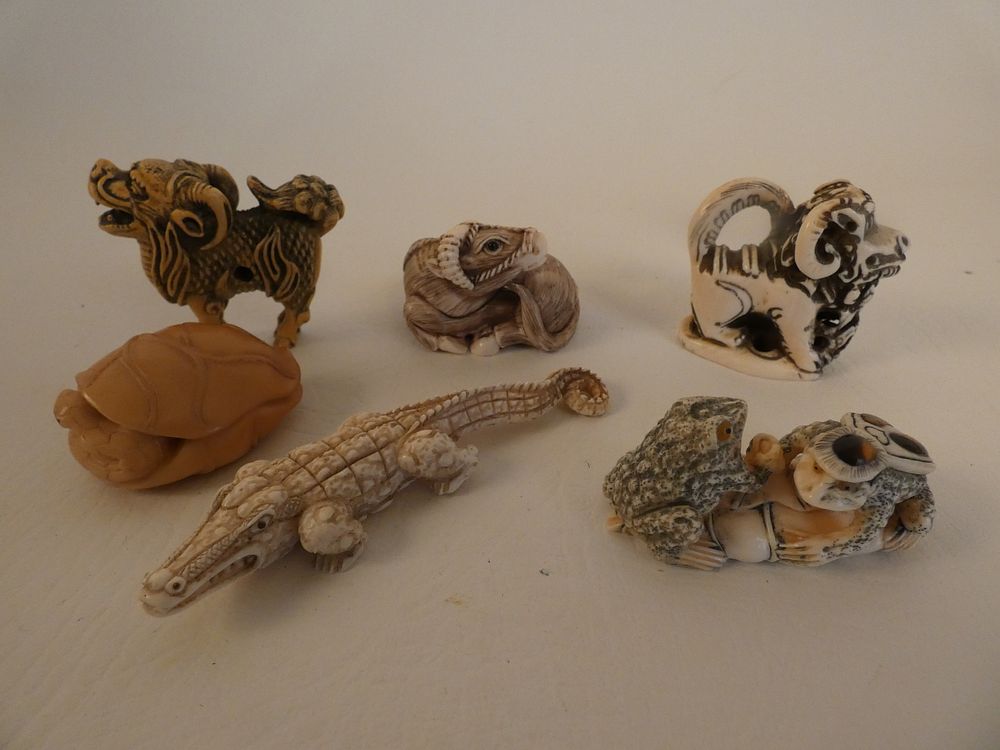 Appraisal: JAPANESE NETSUKE ANIMALS Lot old Japanese carved bone netsukes alligator