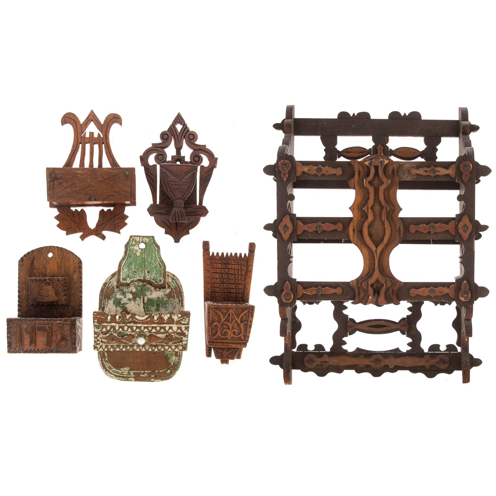 Appraisal: SIX FOLK ART HAND CARVED WALL POCKETS Size of largest