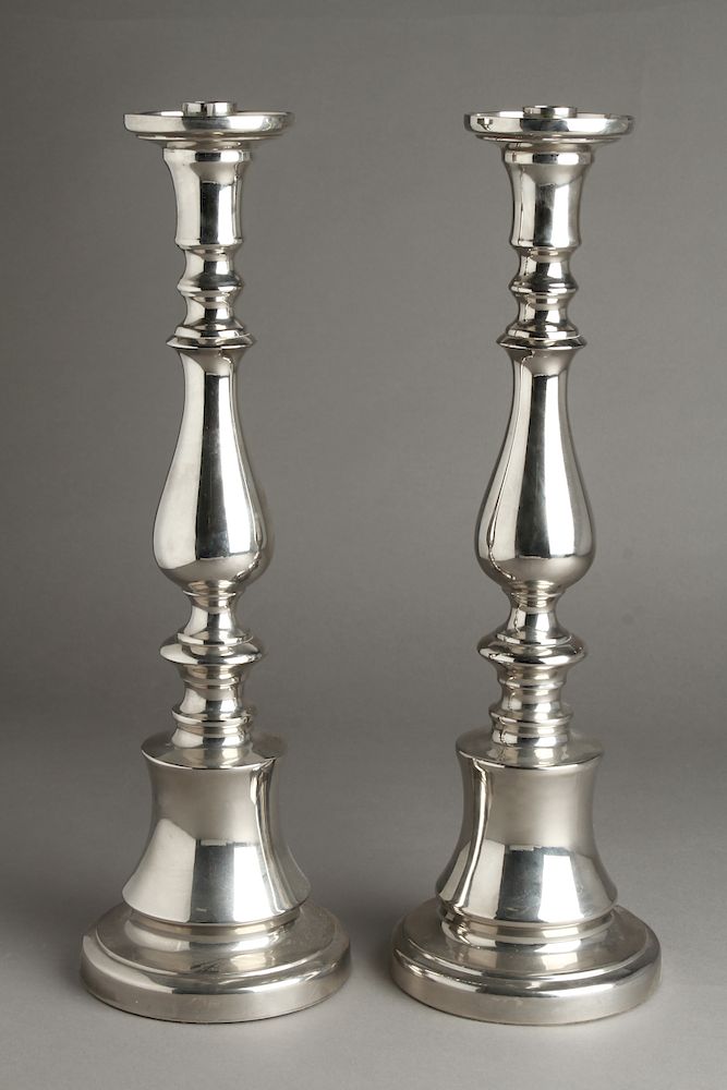 Appraisal: Silver-Tone Polished Cast Aluminum Candlesticks Pr Silver-tone polished cast-aluminum candlesticks