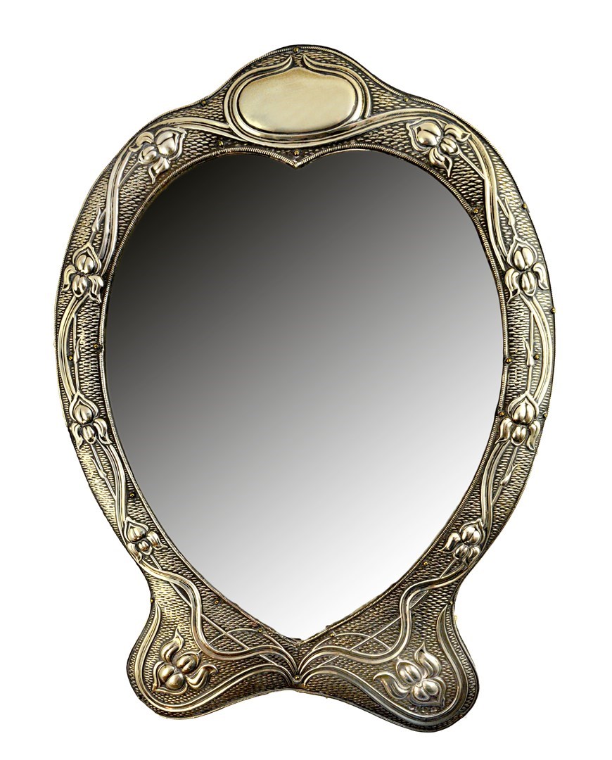 Appraisal: An Art Nouveau silver mounted heart shaped strut backed mirror