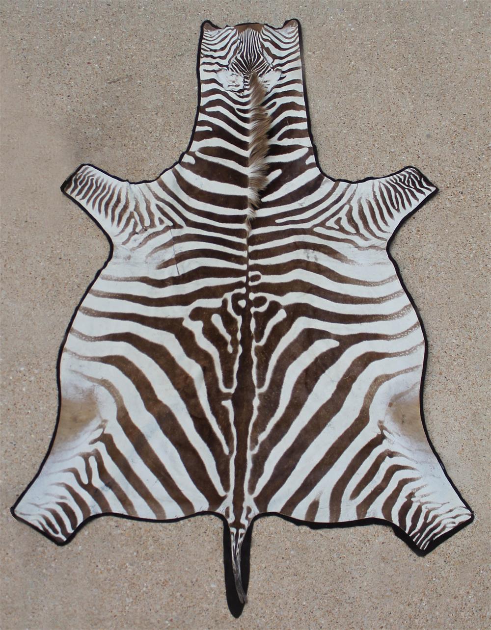 Appraisal: VINTAGE BURCHELL'S ZEBRA RUG medium brown with wider stripes brown