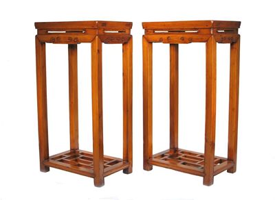 Appraisal: A pair of Chinese jumu elmwood rectangular plant stands the