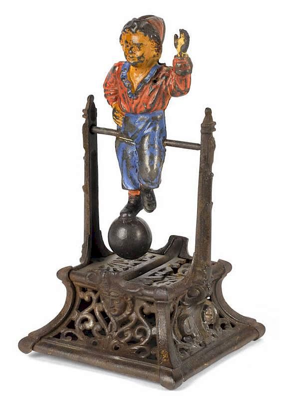 Appraisal: Cast iron Boy on Trapeze mechanical bank manufac Cast iron