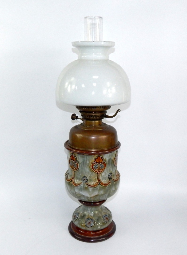 Appraisal: A Royal Doulton stoneware oil lamp of baluster form decorated