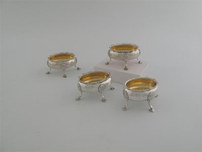 Appraisal: A set of four salts of oval form with gadrooned