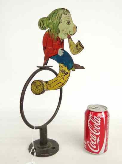 Appraisal: Folk art painted metal balance toy on metal ring base