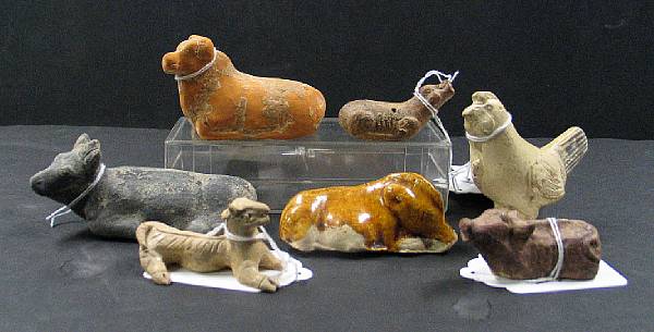 Appraisal: Nine pottery animals Including a straw glazed chicken a recumbent