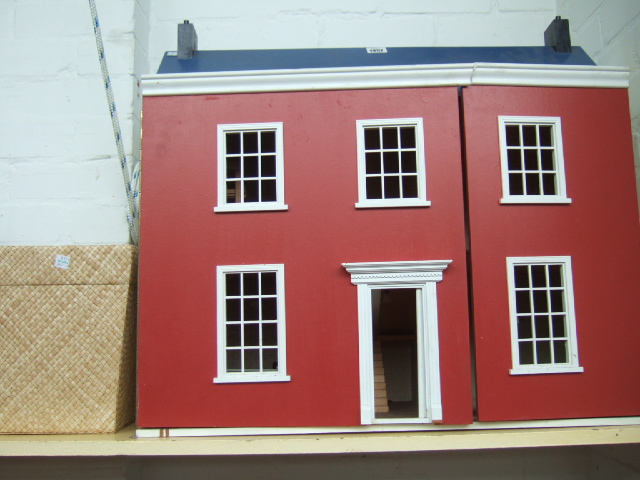 Appraisal: A scratch built Georgian style dolls house with furniture and